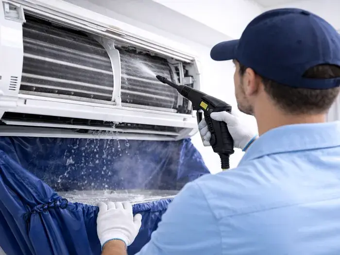 Vayu AC Service technician performing AC cleaning for a home in Greater Noida